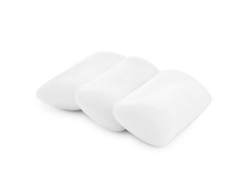 Photo of Three chewing gum pieces on white background
