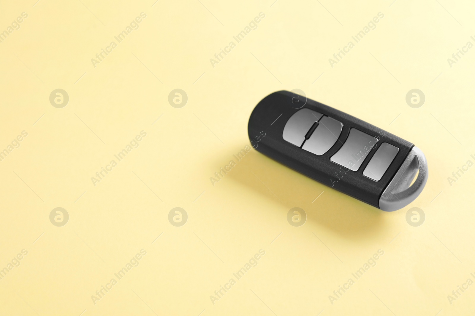 Photo of Car smart key on color background. Space for text