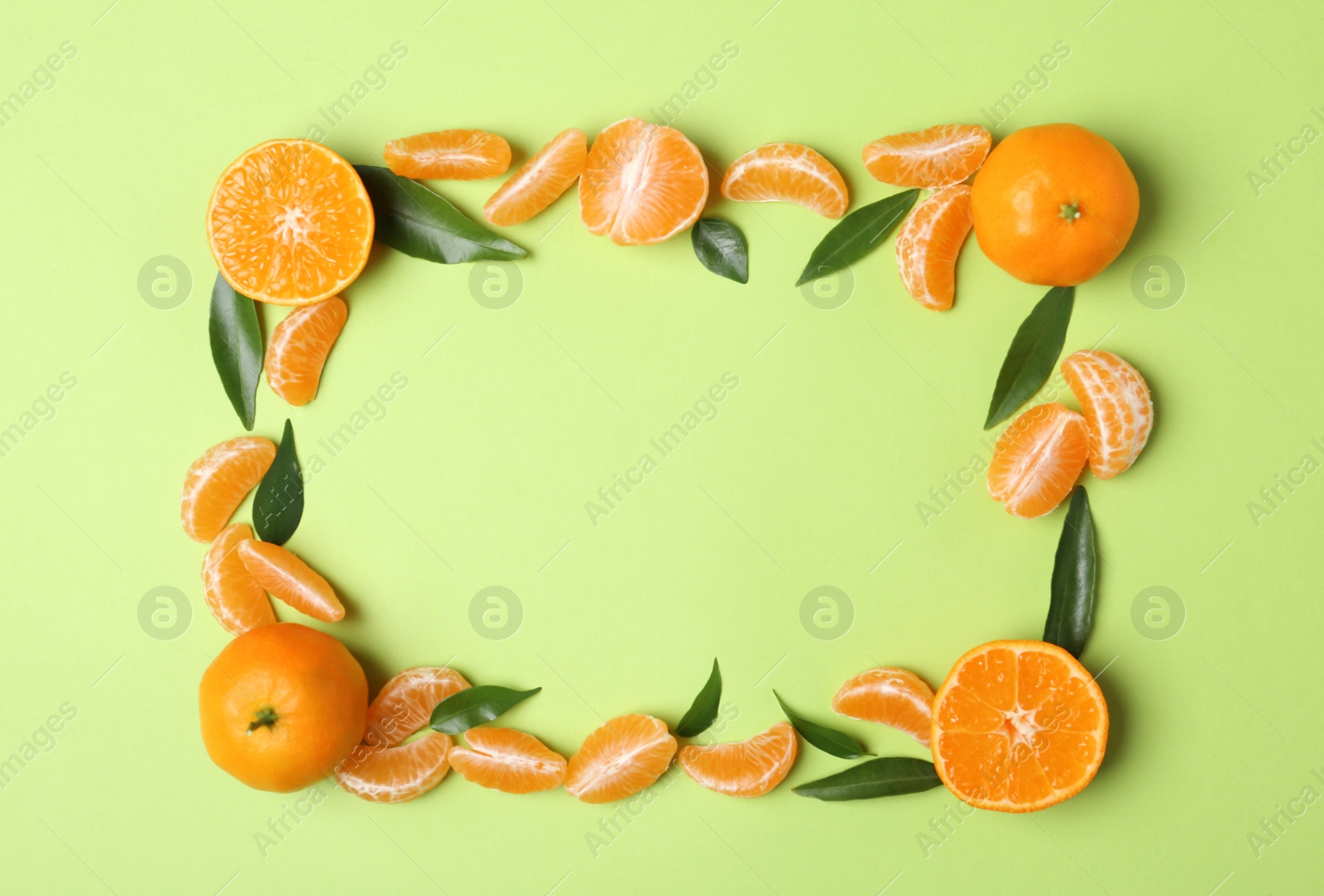 Photo of Composition with tangerines and leaves on color background, flat lay. Space for text