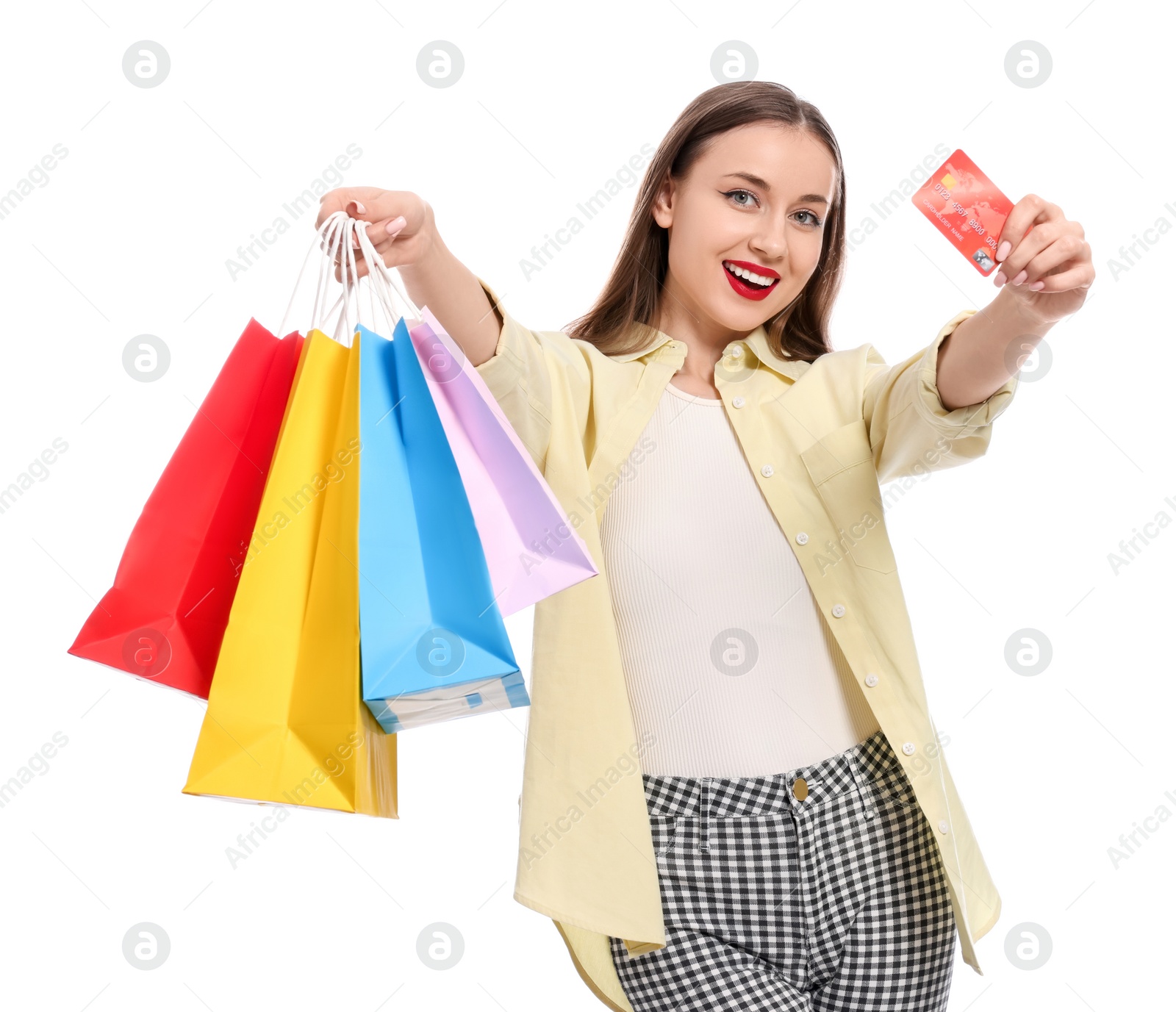 Photo of Stylish young woman with shopping bags and credit card white background