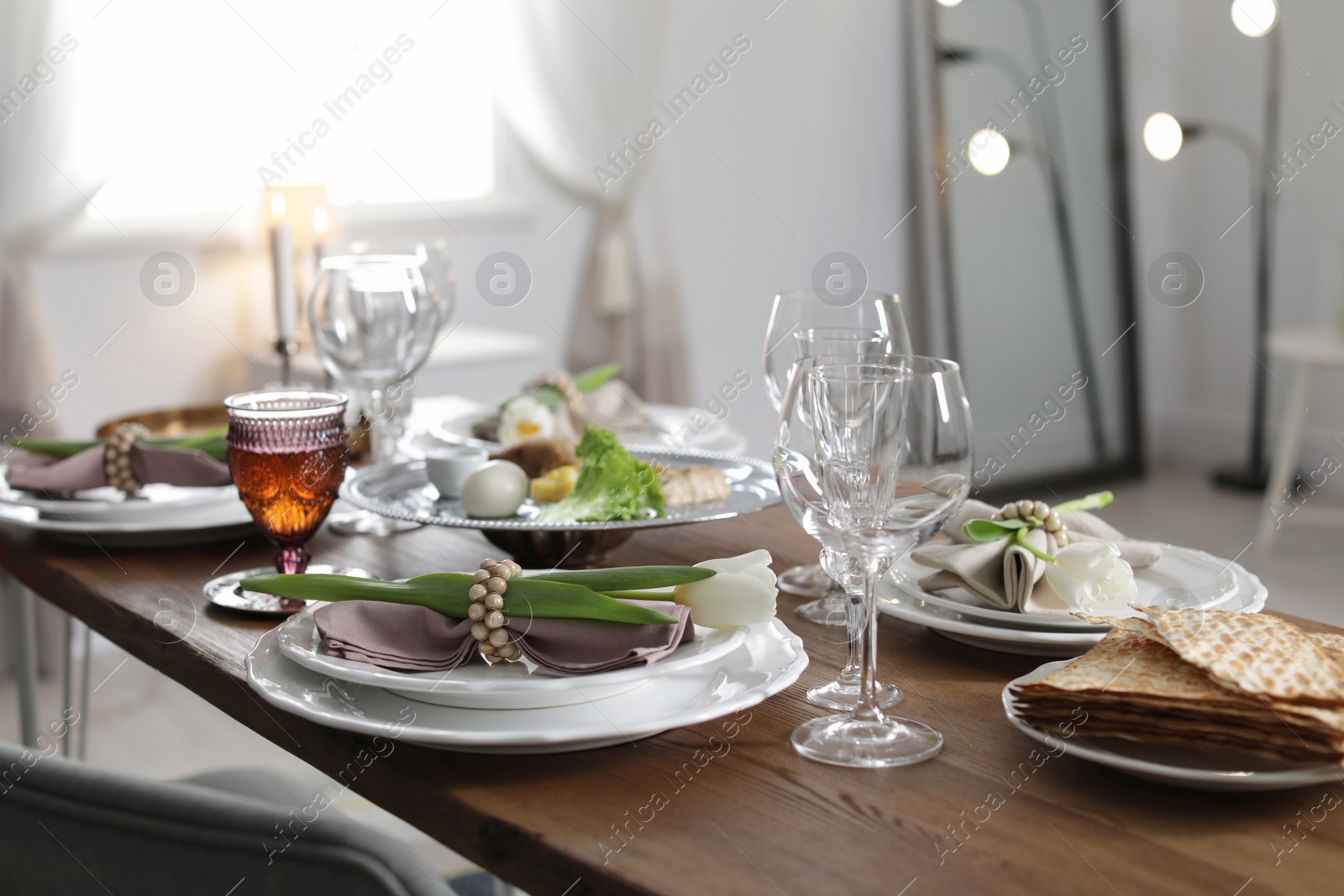 Photo of Festive Passover table setting at home. Pesach celebration