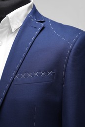 Semi-ready jacket and shirt on mannequin, closeup view