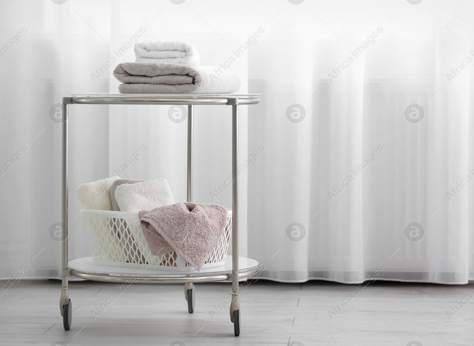 Photo of Cart with clean towels indoors