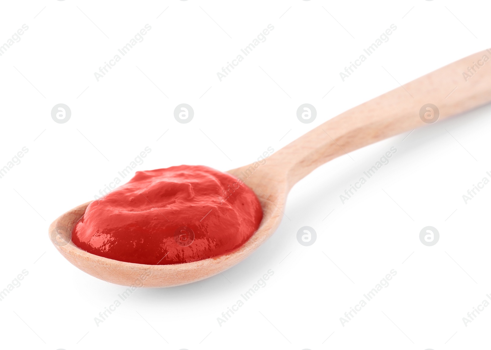 Photo of Tasty tomato sauce in spoon isolated on white