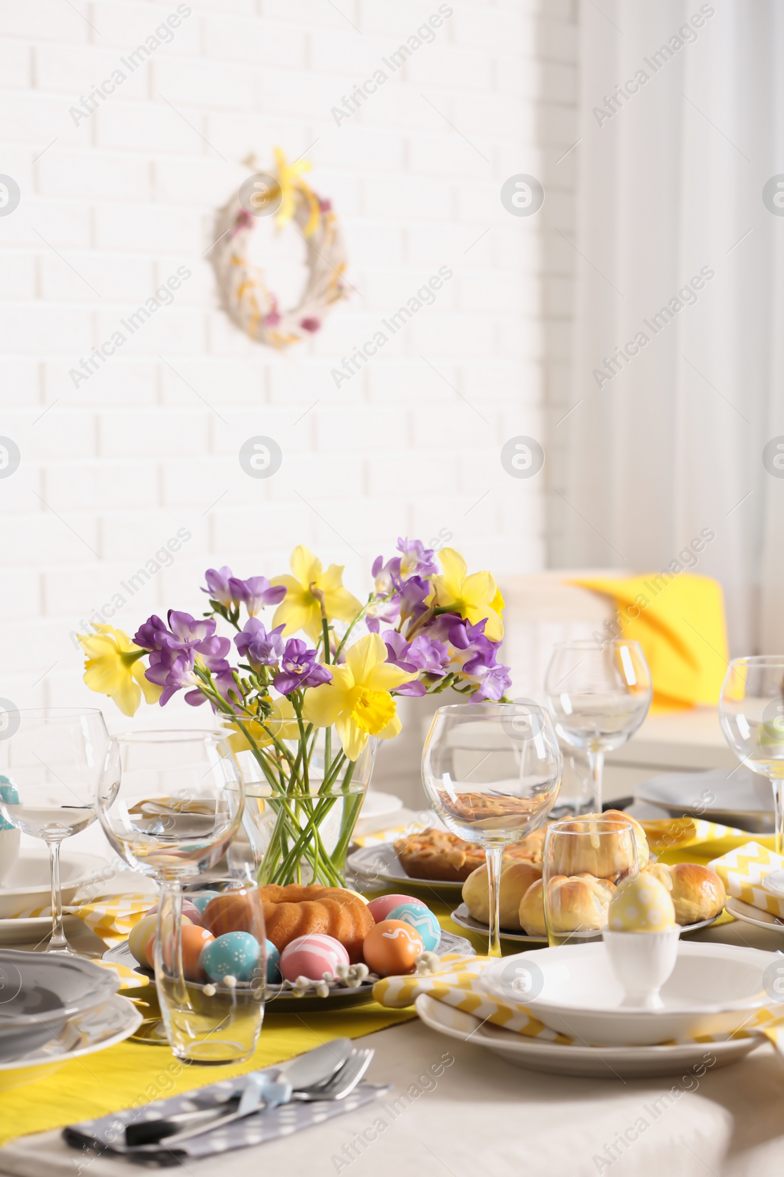 Photo of Festive Easter table setting with traditional meal at home