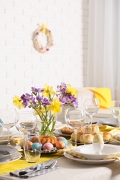 Festive Easter table setting with traditional meal at home