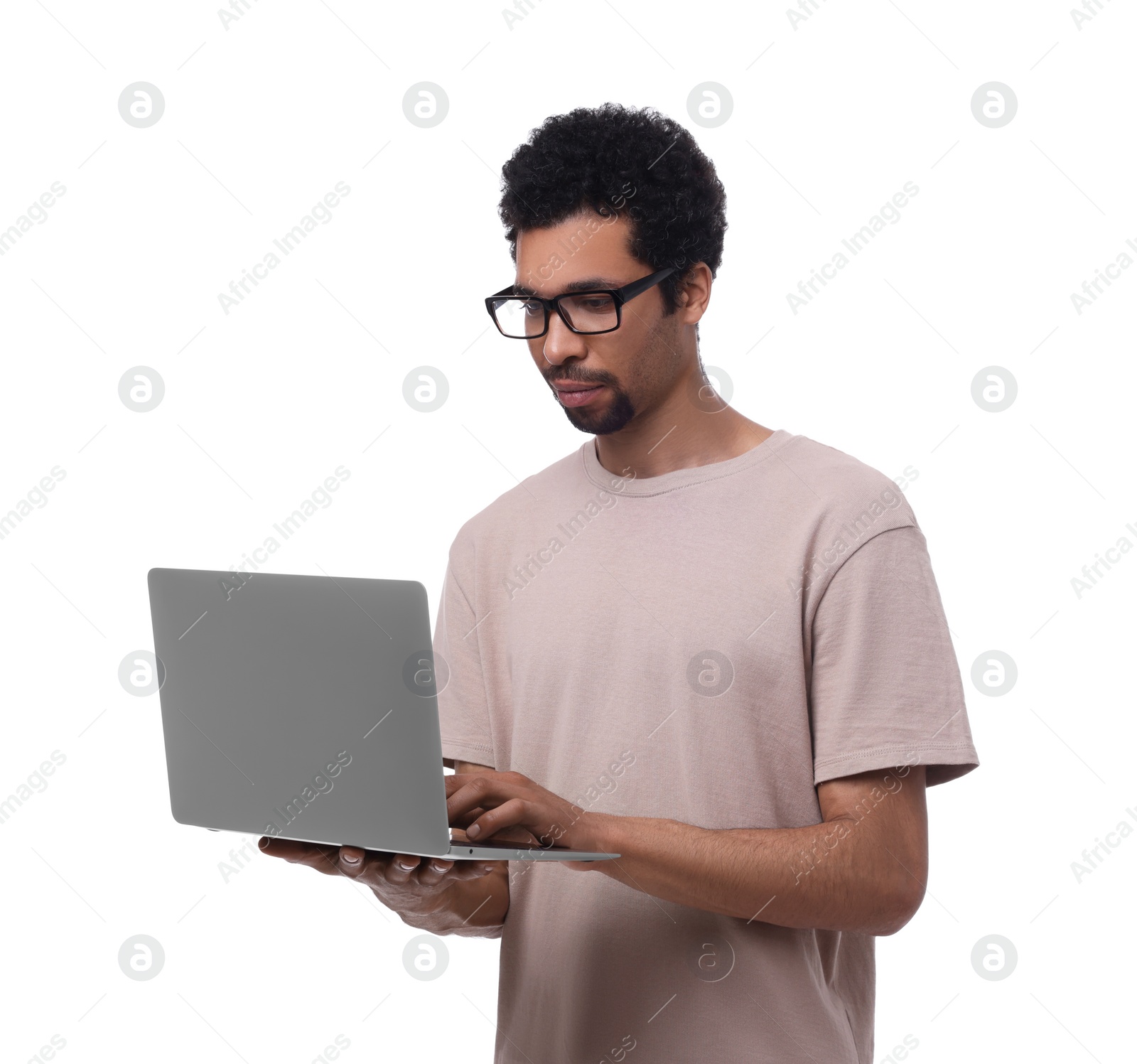 Photo of Handsome man using laptop on white background