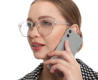 Young businesswoman talking on mobile phone against white background