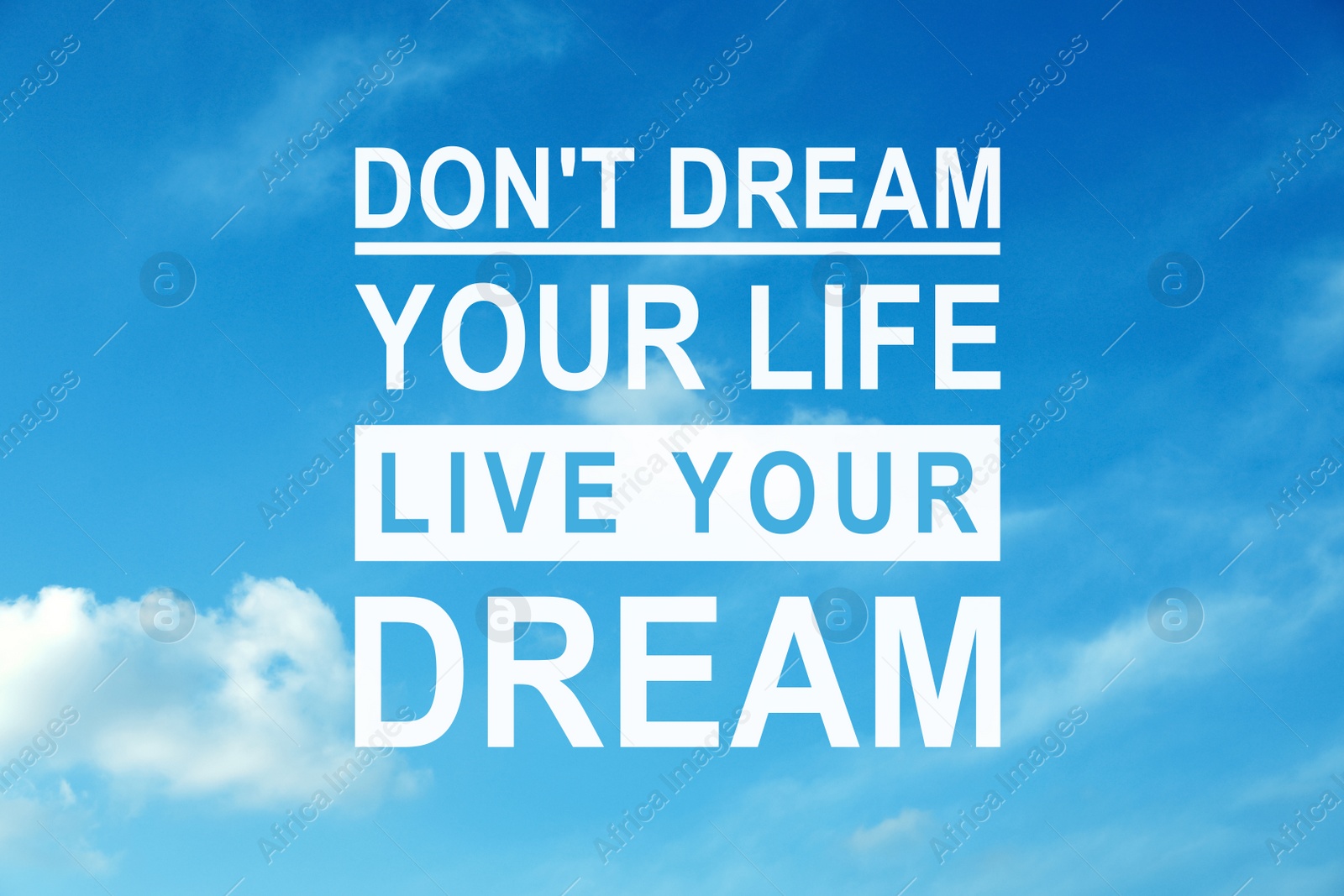 Image of Don't Dream Your Life Live Your Dream. Motivational quote inspiring to make real actions, not only fantasize. Text against blue sky with clouds