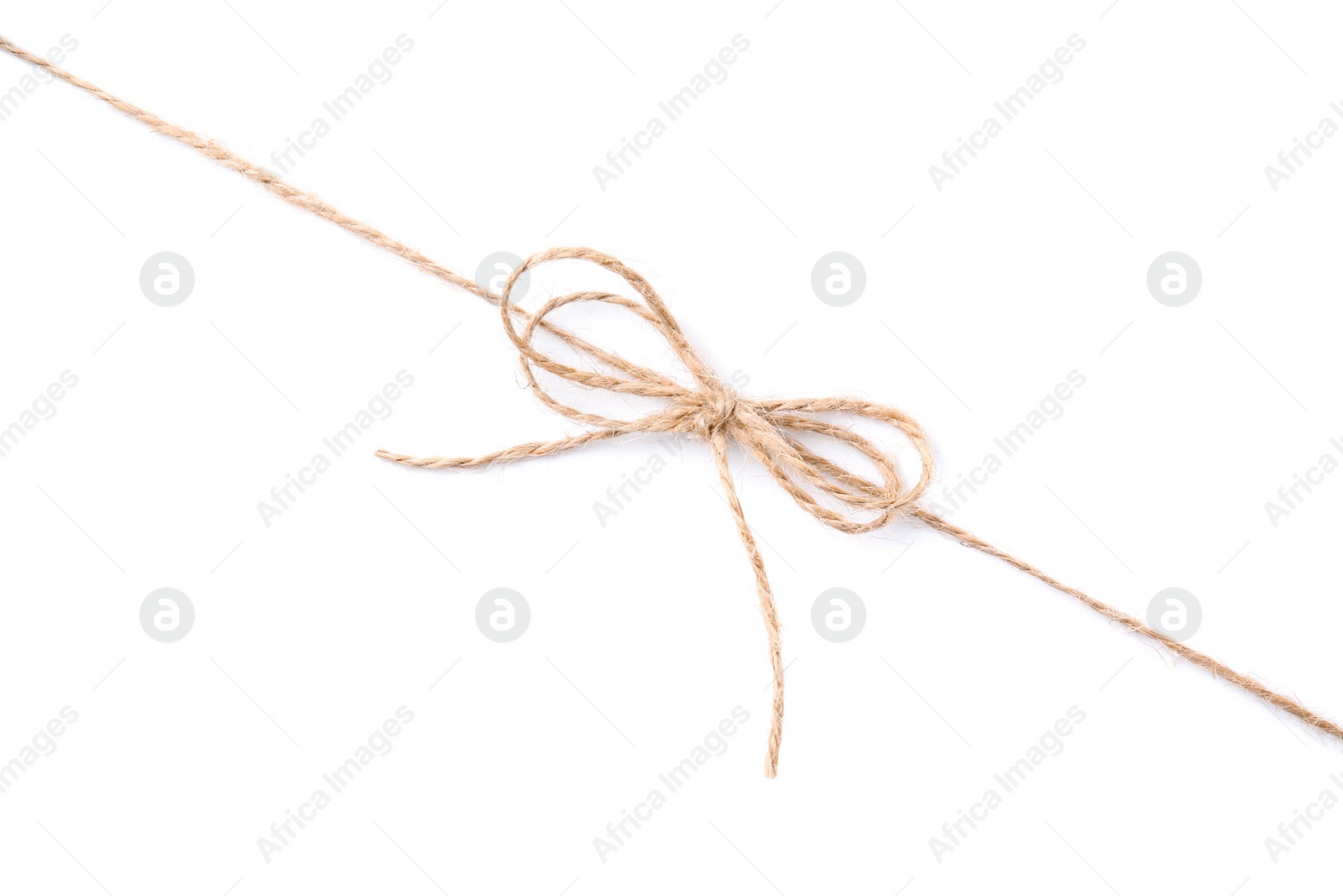 Photo of Linen rope string with bow isolated on white, top view