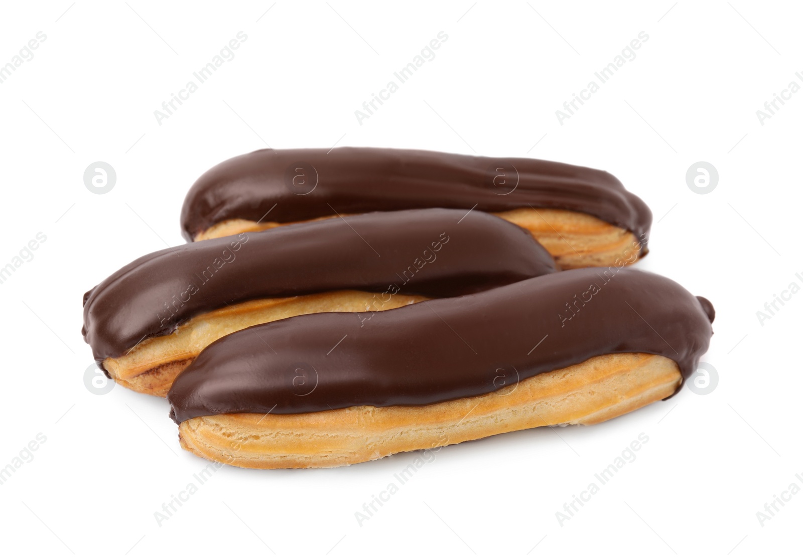 Photo of Delicious eclairs covered with chocolate isolated on white