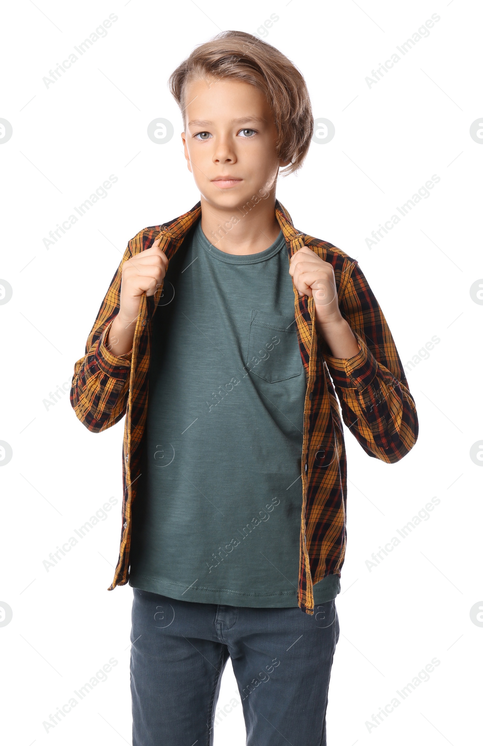 Photo of Portrait of cute little boy in casual outfit on white background