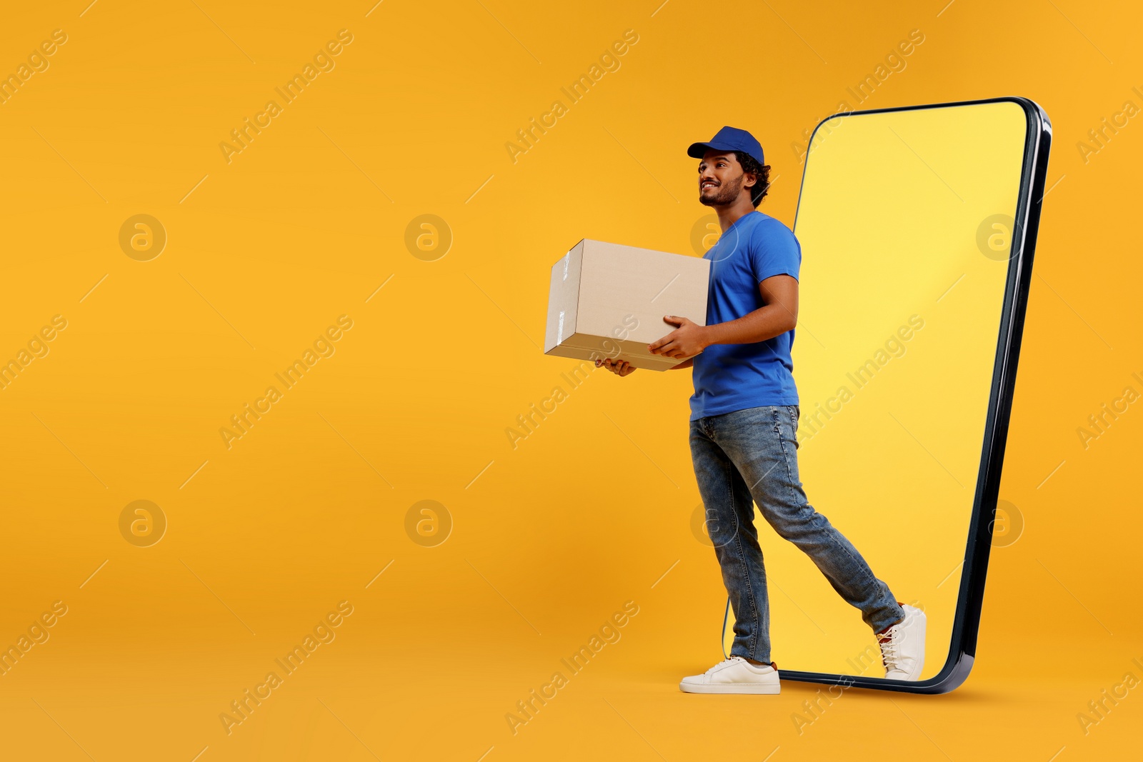 Image of Courier with parcel walking out from huge smartphone on orange background. Delivery service. Space for text