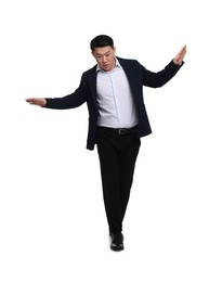 Businessman in suit posing on white background