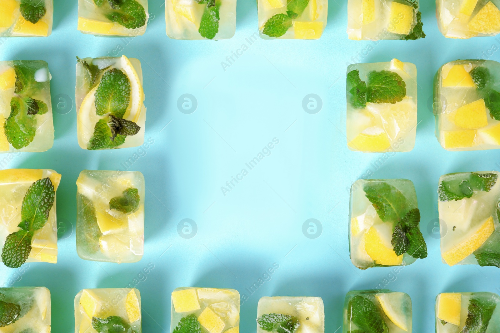 Photo of Flat lay composition with lemon and mint ice cubes on color background. Space for text