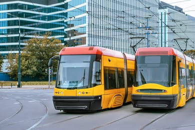 Modern trams on city street. Public transport