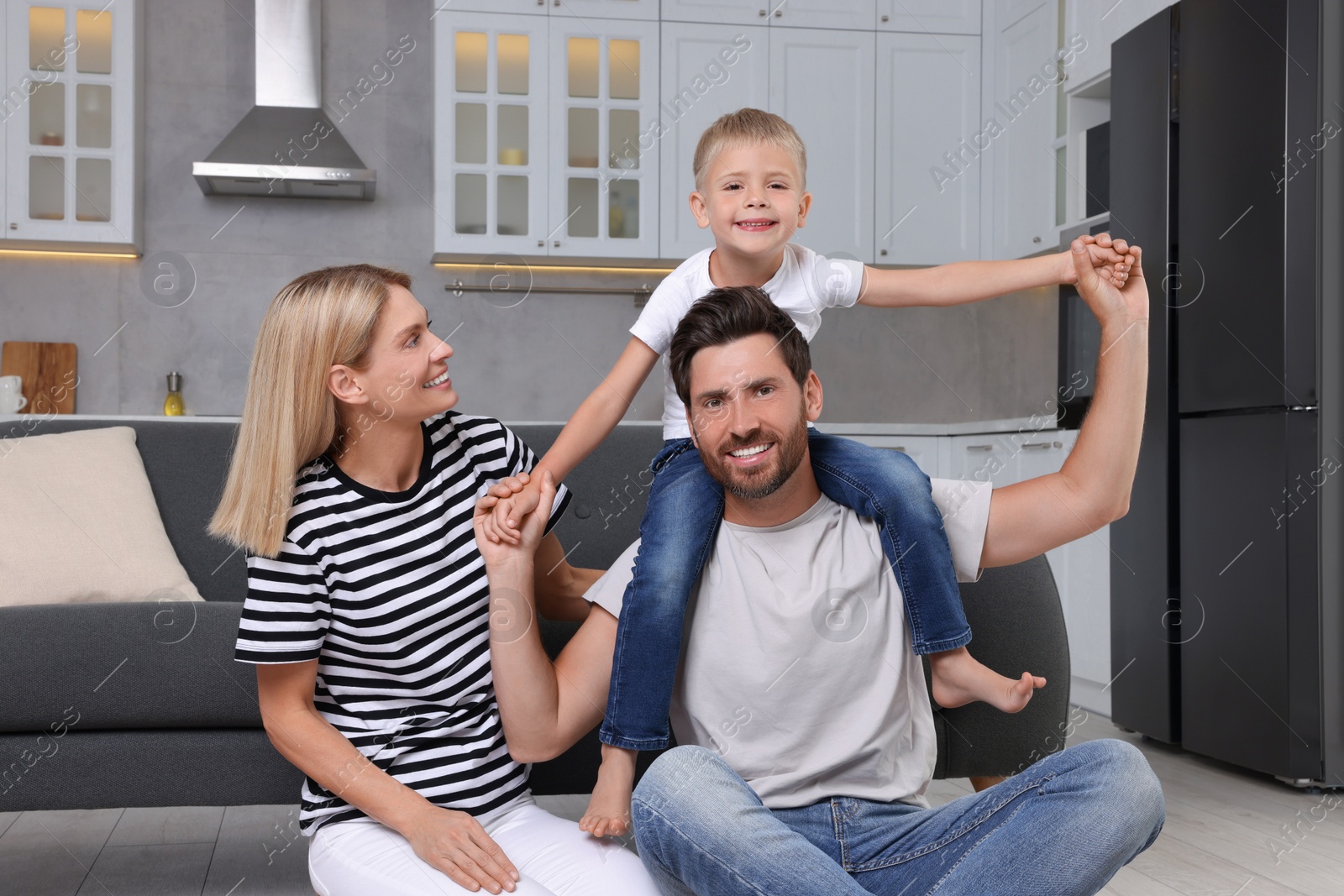 Photo of Happy family having fun together at home