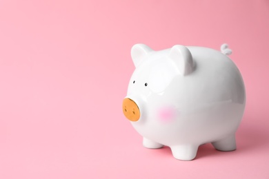 Photo of White piggy bank on color background. Money saving