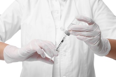 Doctor holding medical syringe on white background, closeup