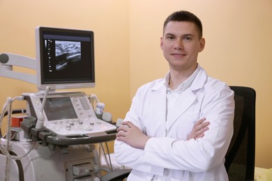 Photo of Portrait of mammologist near ultrasound machine in clinic