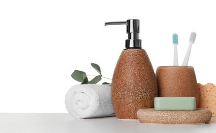 Photo of Bath accessories. Different personal care products and eucalyptus branch on table against white background. Space for text