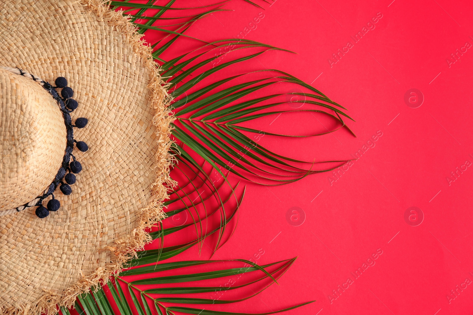 Photo of Bamboo hat and space for text on color background, top view