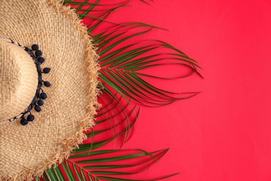 Photo of Bamboo hat and space for text on color background, top view