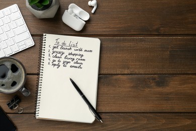 Flat lay composition with to do list on wooden table, space for text
