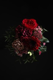 Photo of Beautiful bouquet of fresh flowers on dark background