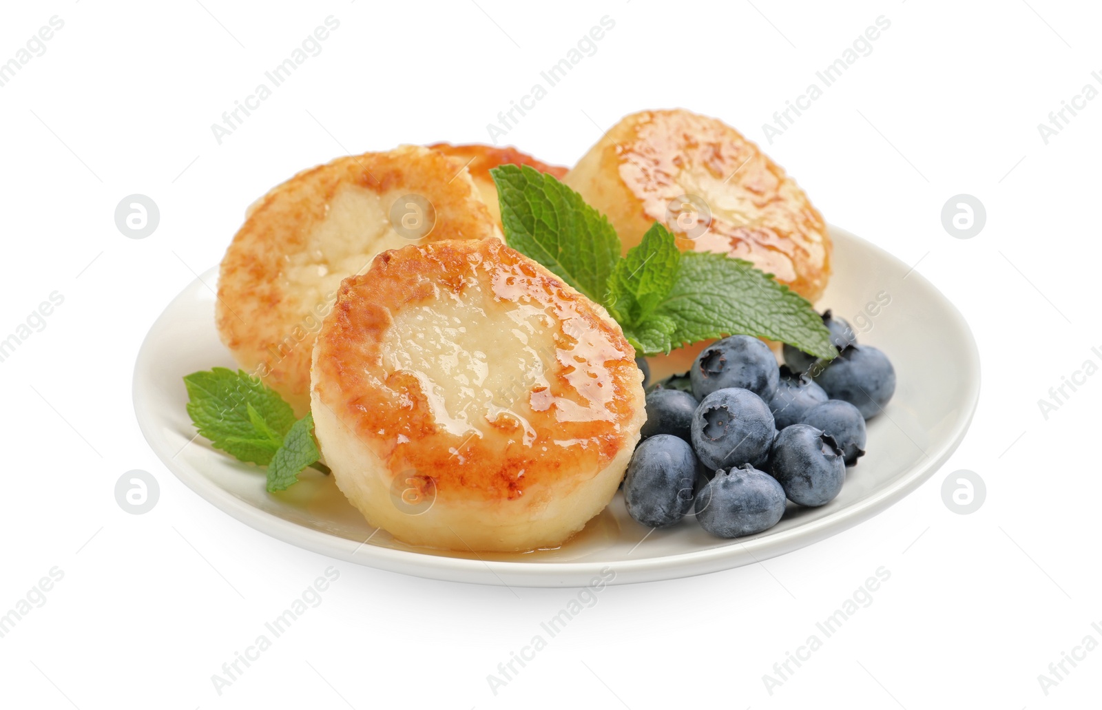 Photo of Delicious cottage cheese pancakes with blueberries, honey and mint on white background