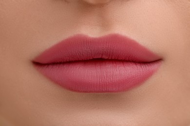 Photo of Young woman with beautiful full lips as background, closeup