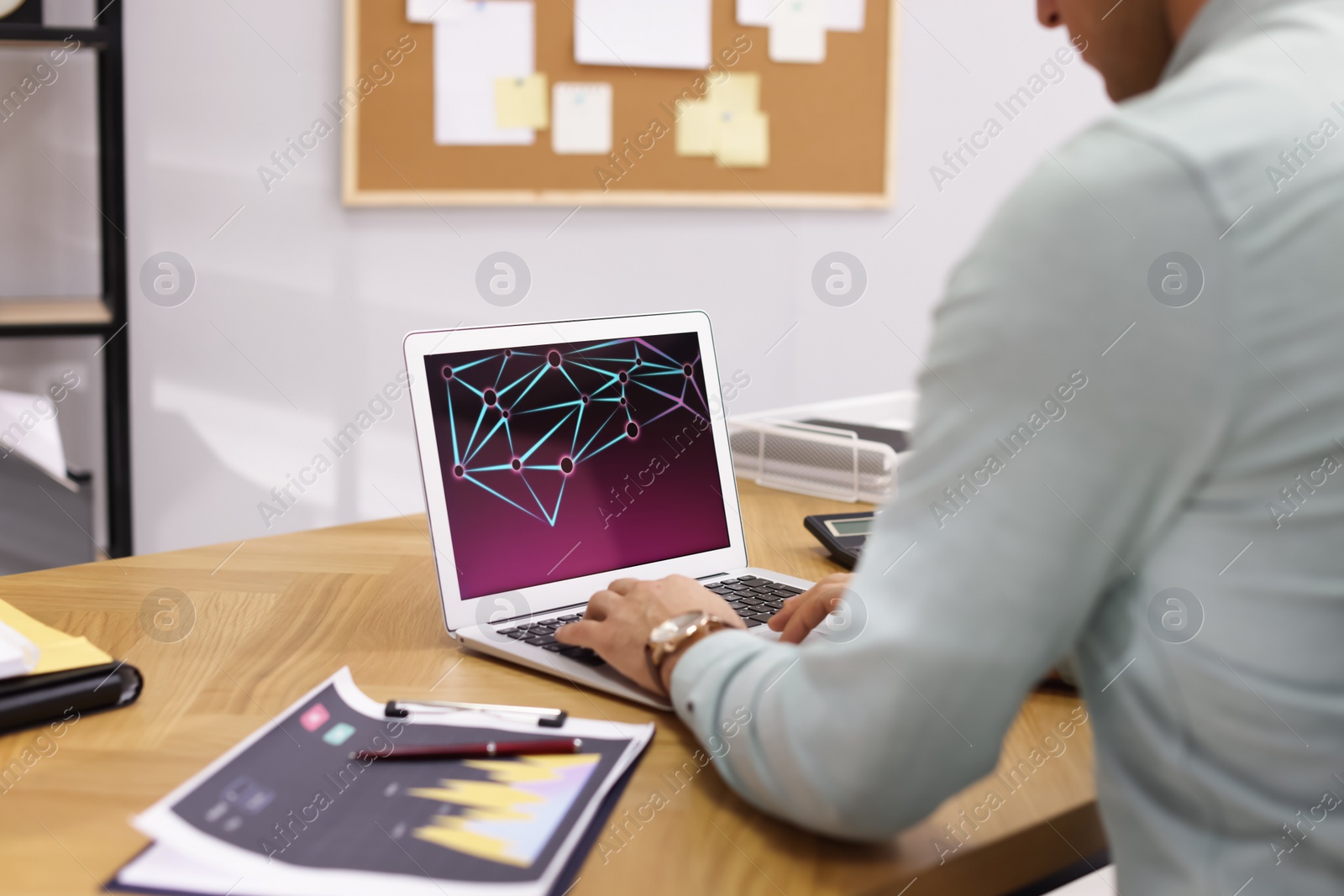 Photo of Businessman working with laptop in office, closeup. Forex trading