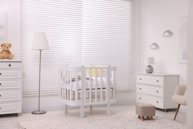 Photo of Modern baby room interior with stylish crib