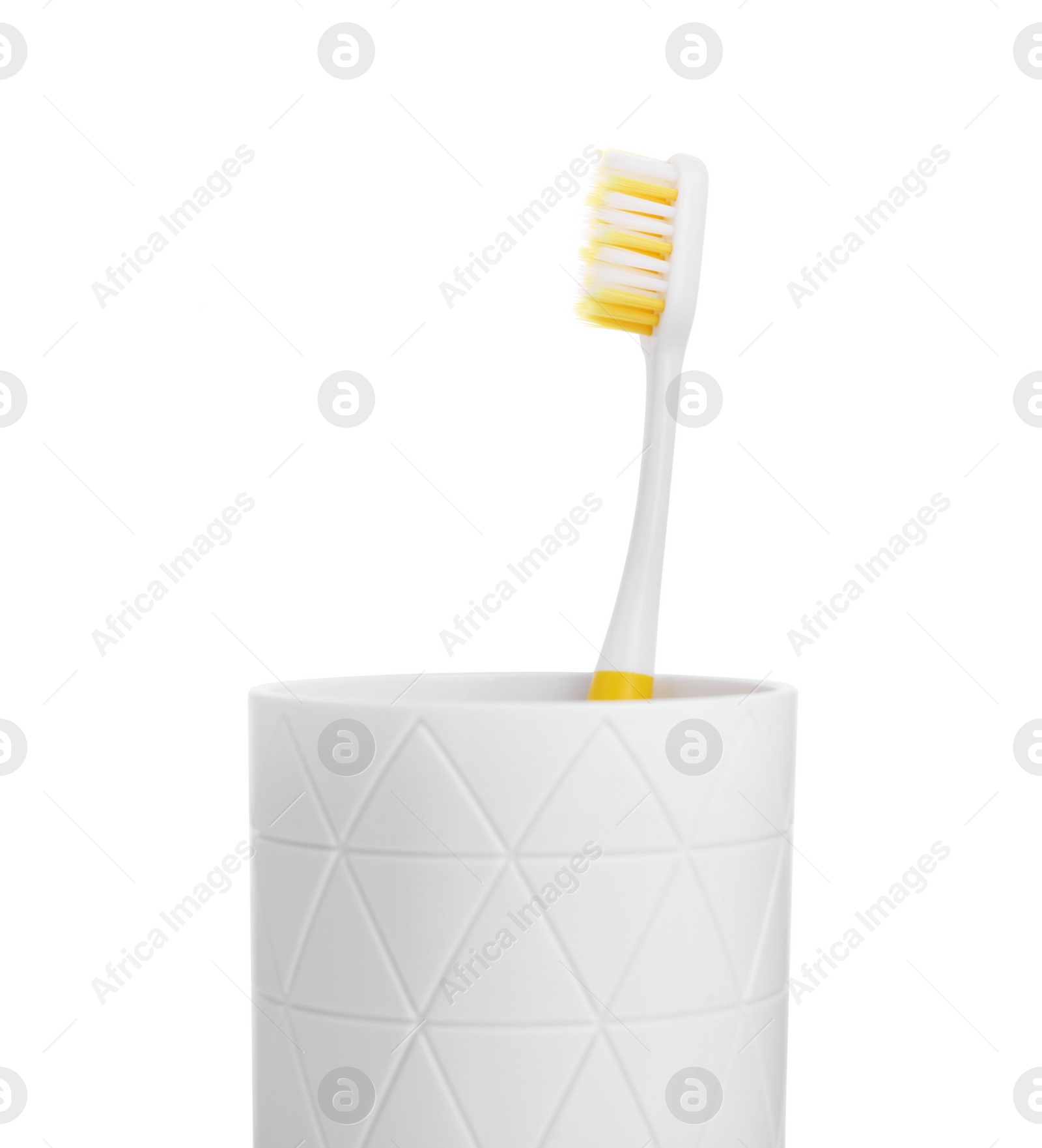 Photo of One plastic toothbrush in holder isolated on white