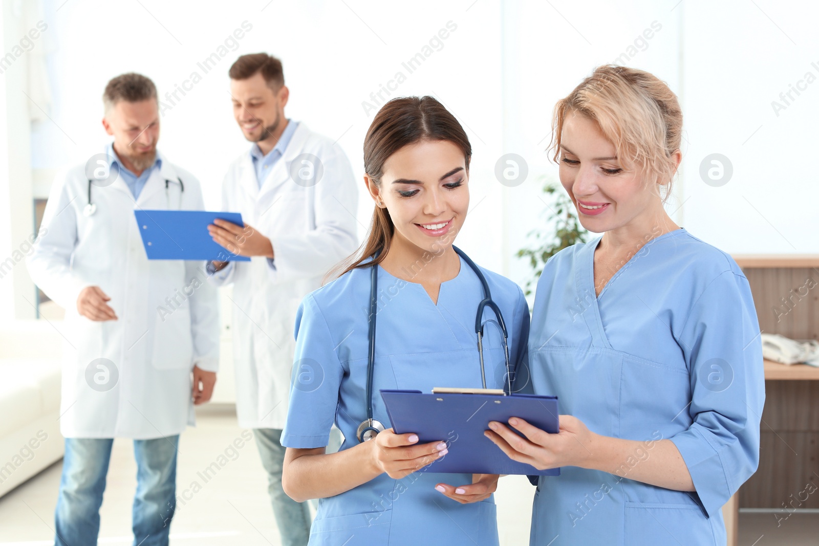 Photo of Medical assistants and doctors in clinic. Health care service