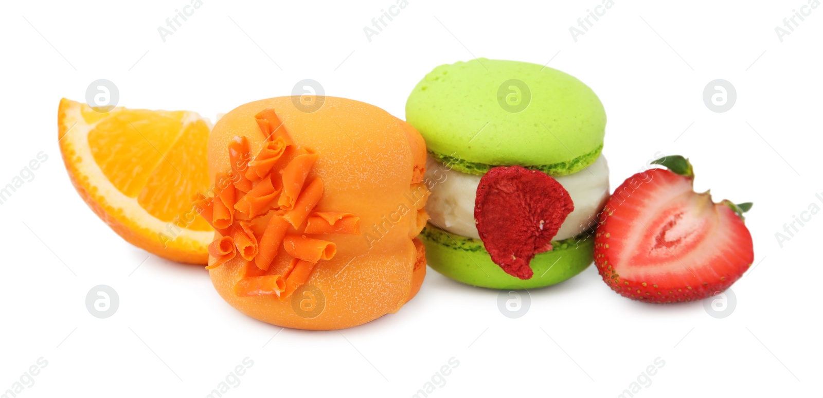 Photo of Delicious sweet macarons, strawberry and orange slice isolated on white