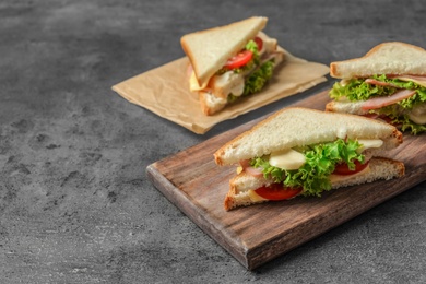 Tasty toast sandwiches on table. Wheat bread