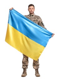 Soldier in military uniform with Ukrainian flag on white background