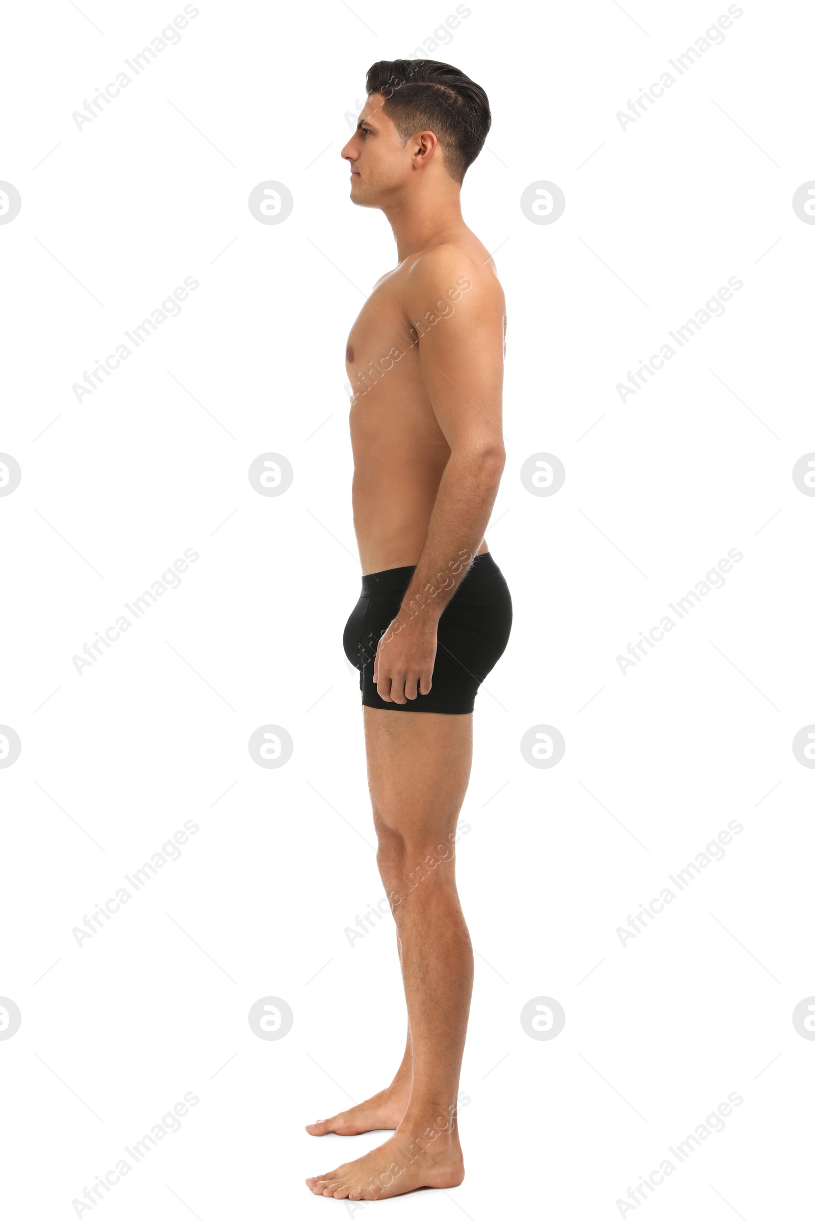 Photo of Handsome man in black underwear on white background