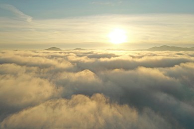 Photo of Aerial view of beautiful mountains above clouds