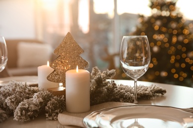 Photo of Elegant table setting with Christmas decor indoors