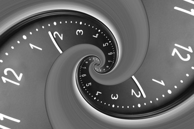 Image of Infinity and other time related concepts. Black clock face twisted in spiral, fractal pattern