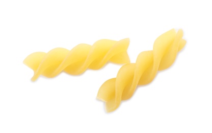 Photo of Uncooked fusilli pasta on white background