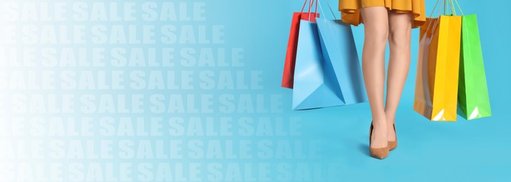 Image of Sale banner or flyer design. Woman holding shopping bags on light blue gradient background, closeup