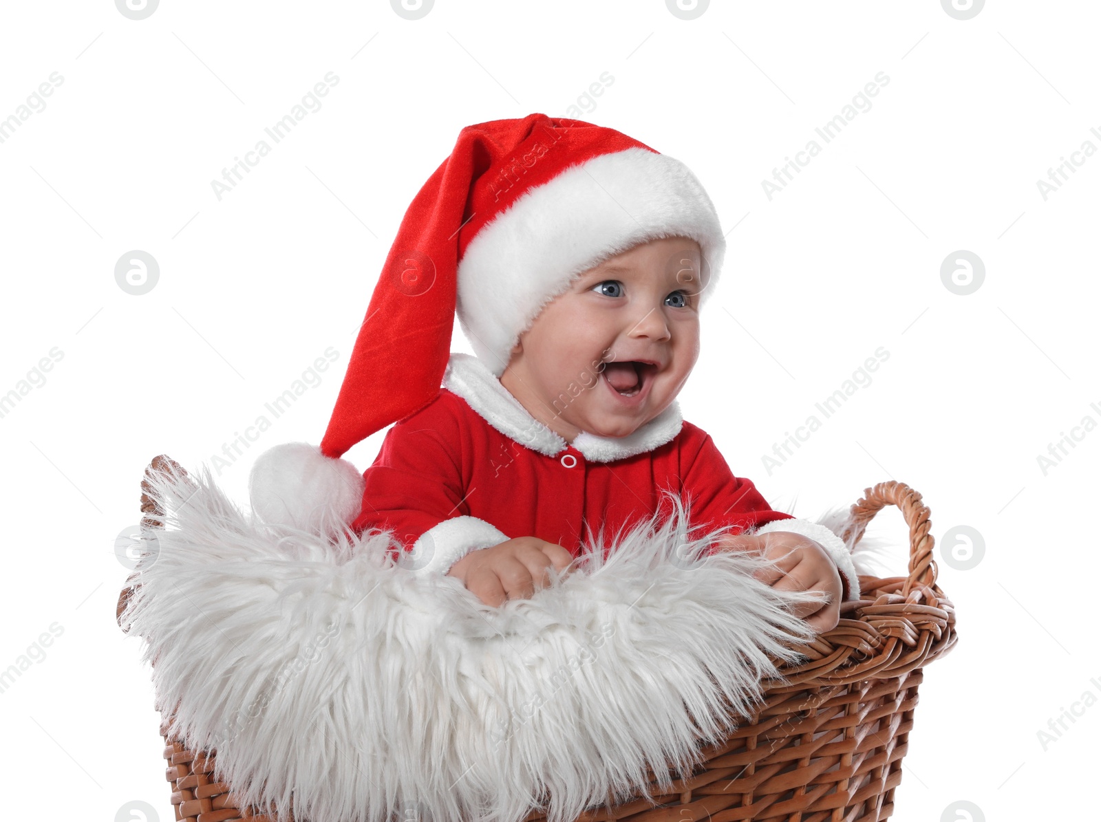 Photo of Cute baby in wicker basket on white background. Christmas celebration