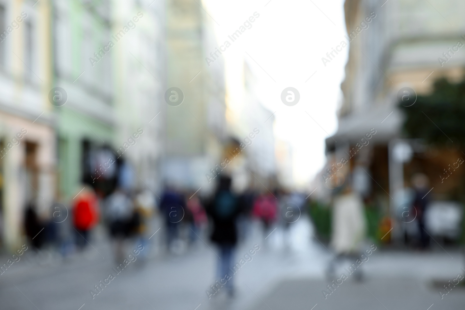 Photo of Blurred view of people walking on city street