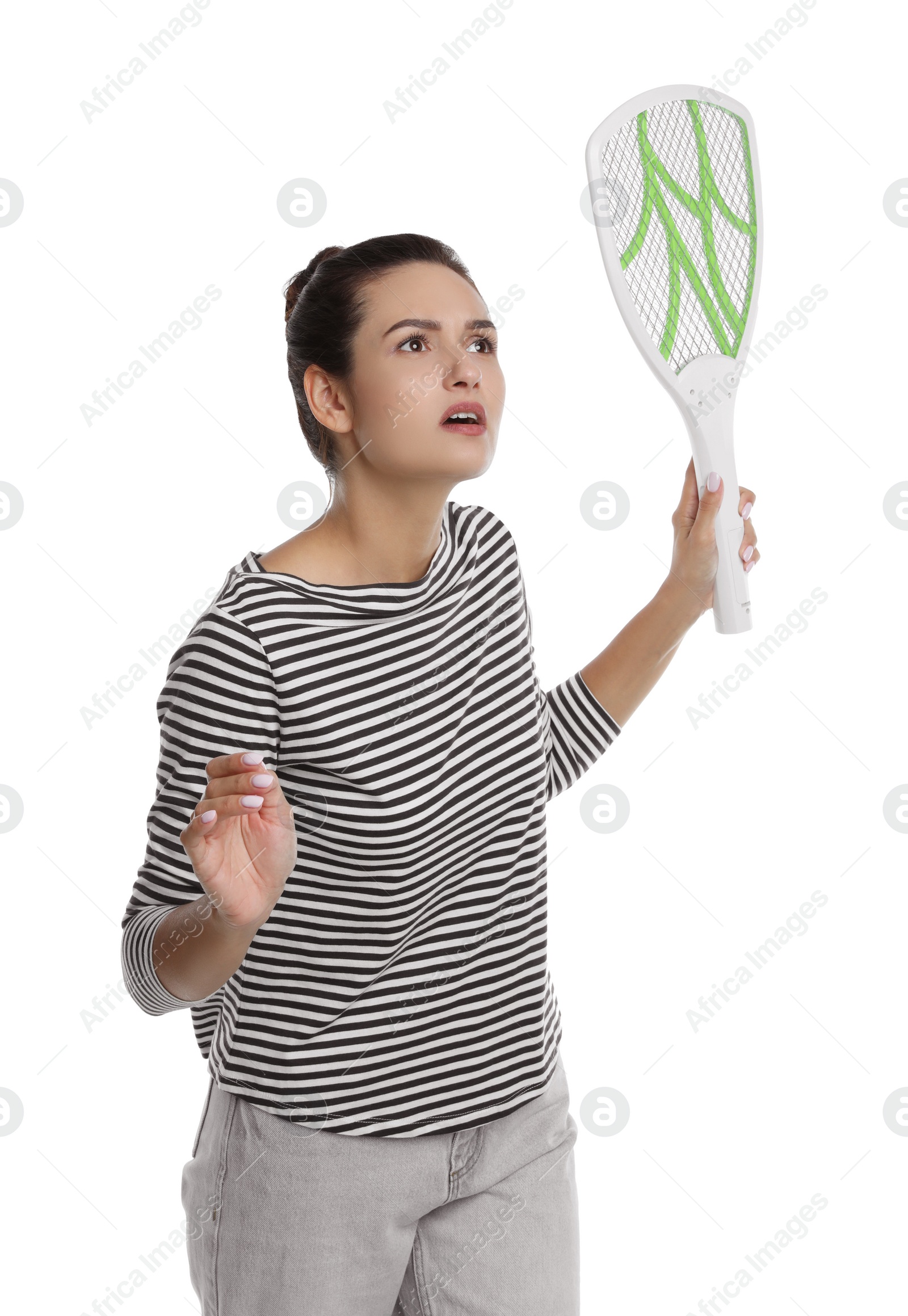 Photo of Young woman with electric fly swatter on white background. Insect killer