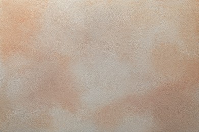 Photo of Beige textured surface as background, top view