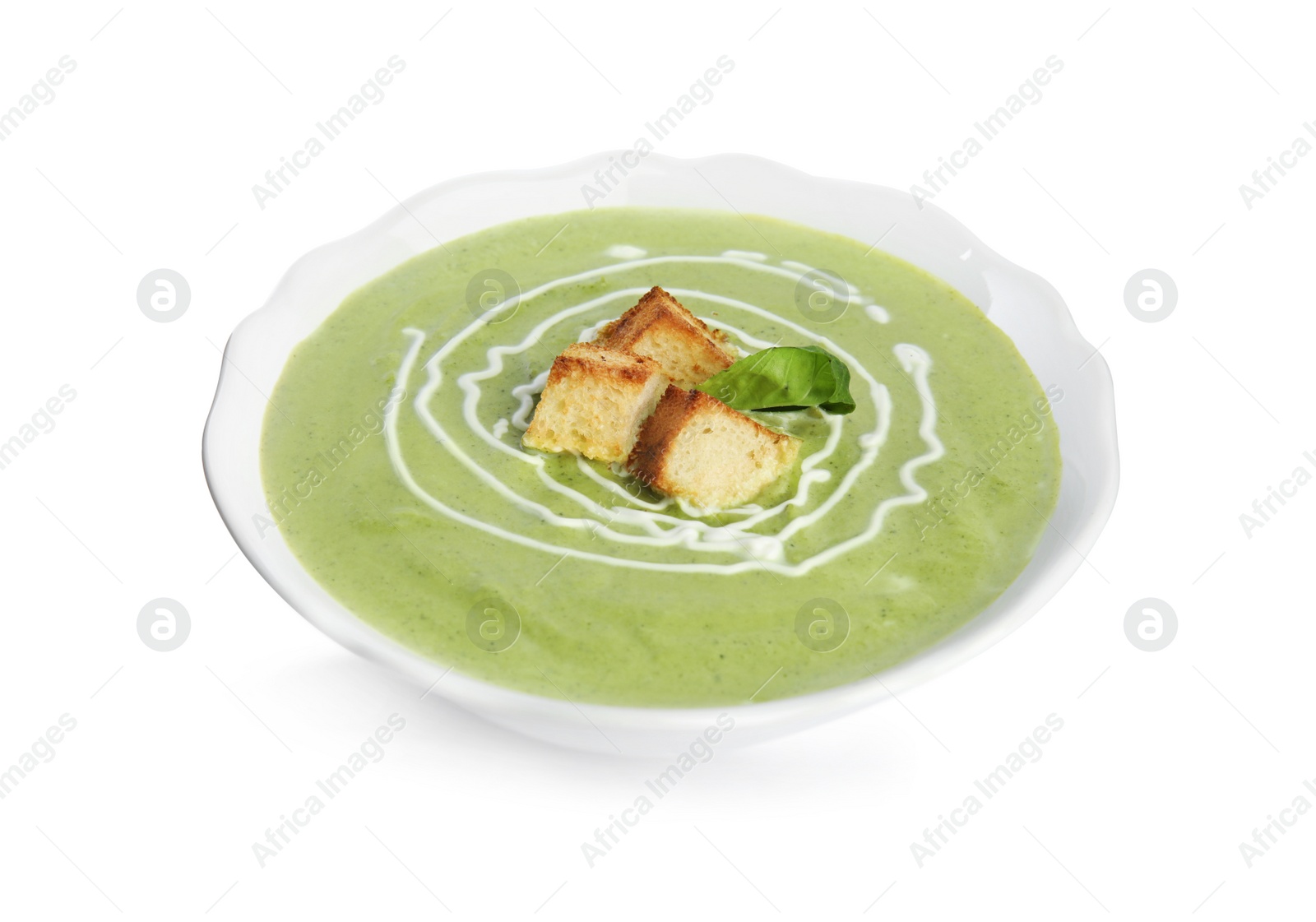 Photo of Delicious broccoli cream soup with croutons isolated on white