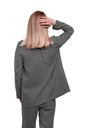 Businesswoman in suit on white background, back view